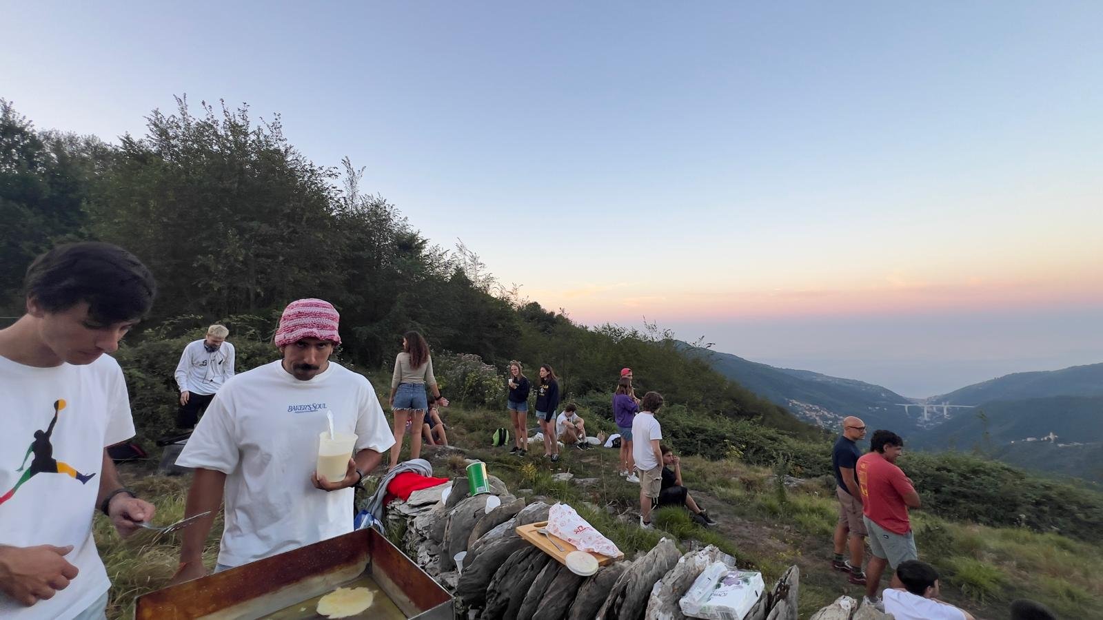 A bright photo of a convivial outdoor table with a nature view